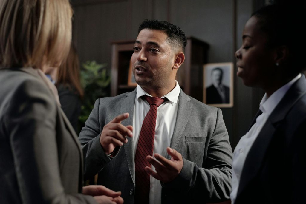 Legal professional consulting clients about representation and case support
