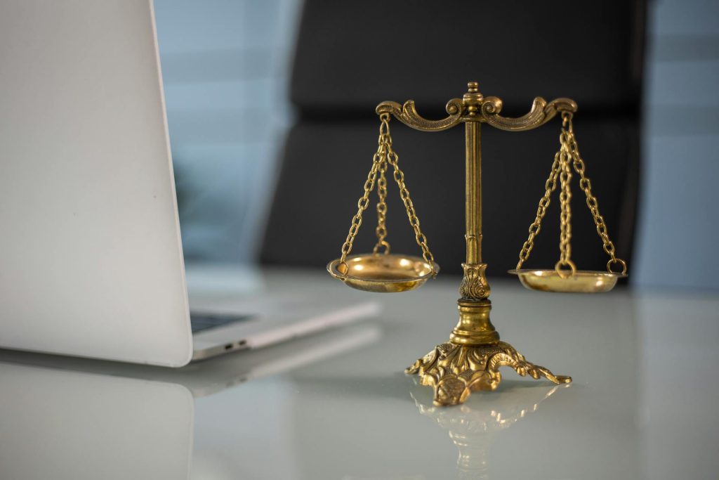 Symbolic golden scale of justice on desk for resolution and risk management