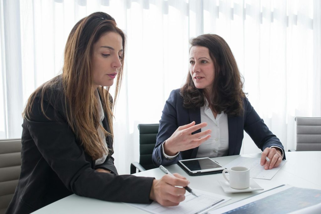 Team reviewing onboarding documents for new real estate agents in Toronto