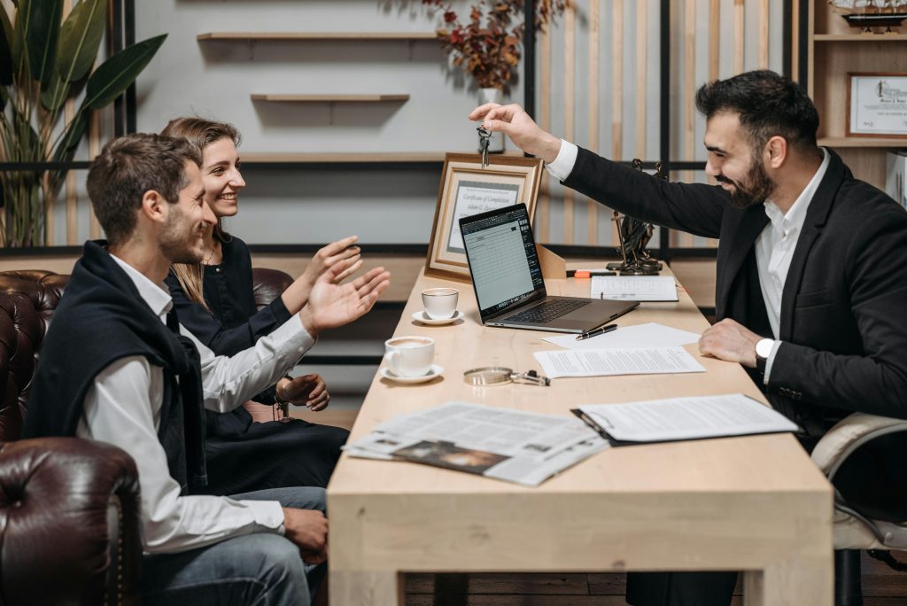 Business partners celebrating success during a real estate meeting in Toronto