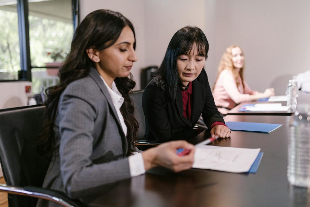 Real estate professionals handling agent board registration paperwork in Toronto