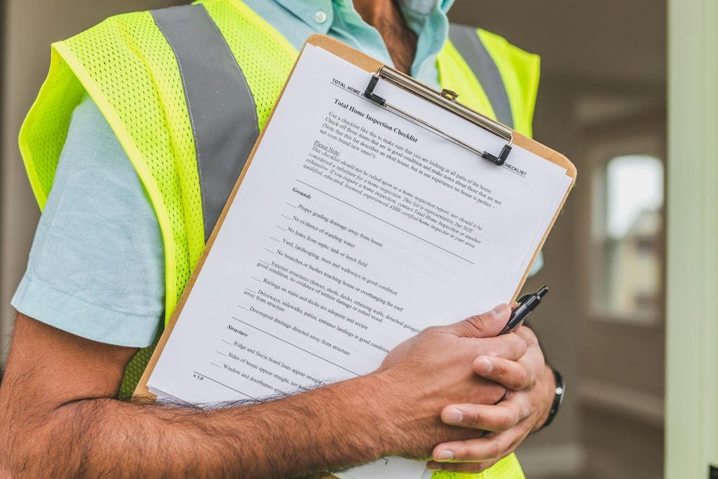 Inspector holding compliance checklist for Toronto real estate brokerage standards
