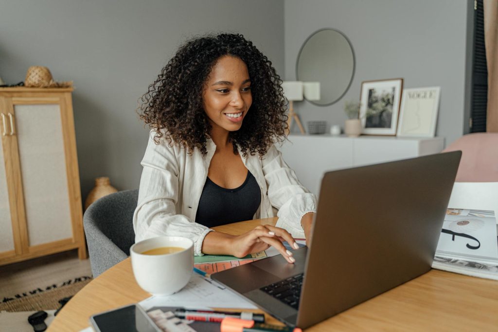 Professional woman completing documentation and onboarding tasks on laptop