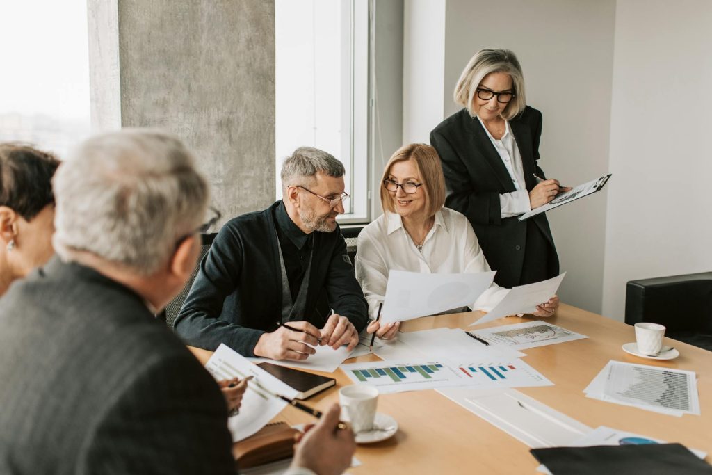 Real estate professionals planning campaign strategy and reporting in Toronto office