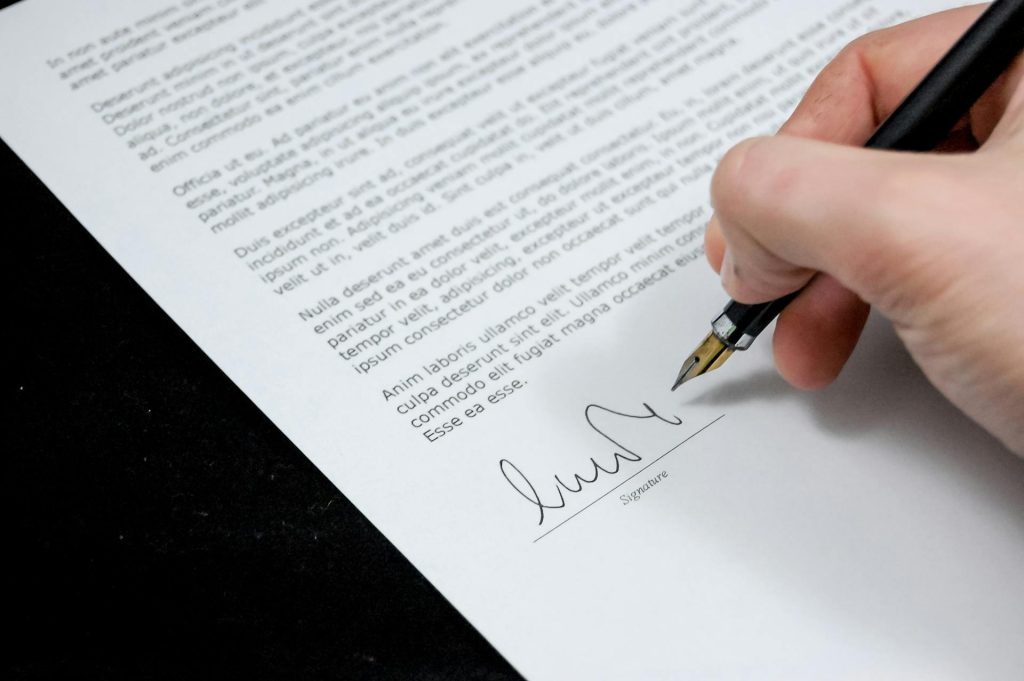 Real estate professional studying updated legislation and transaction forms.